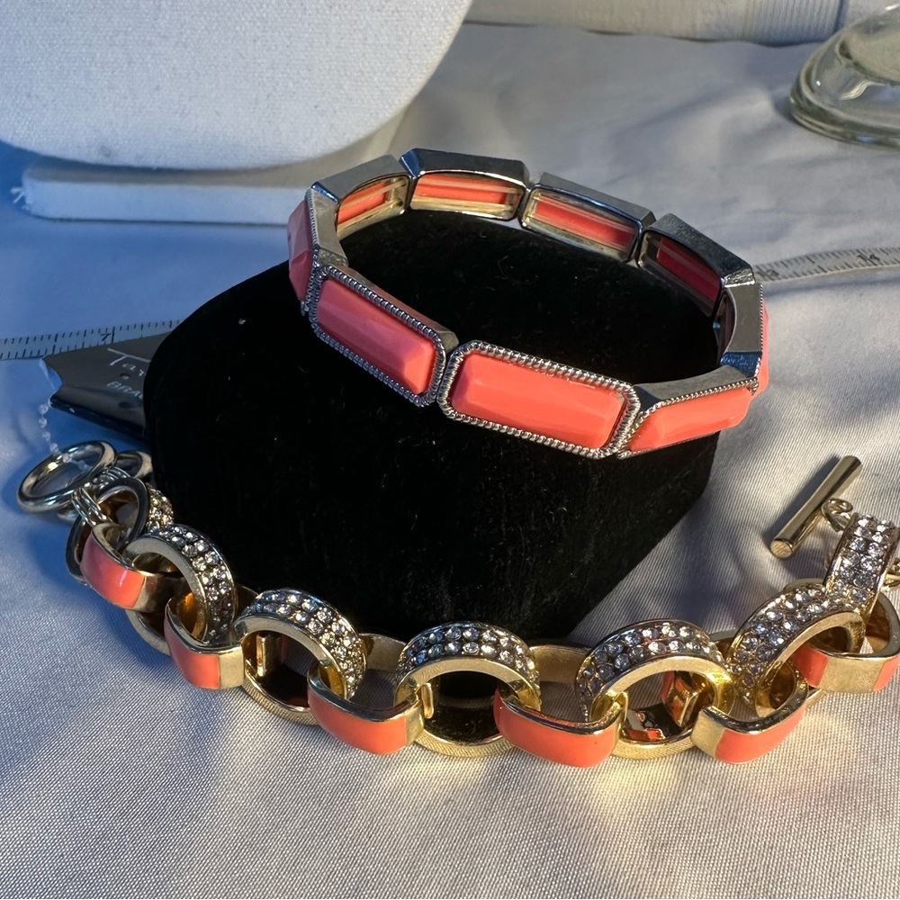 Two Goldtone bracelets with rhinestones and salmon orange colors